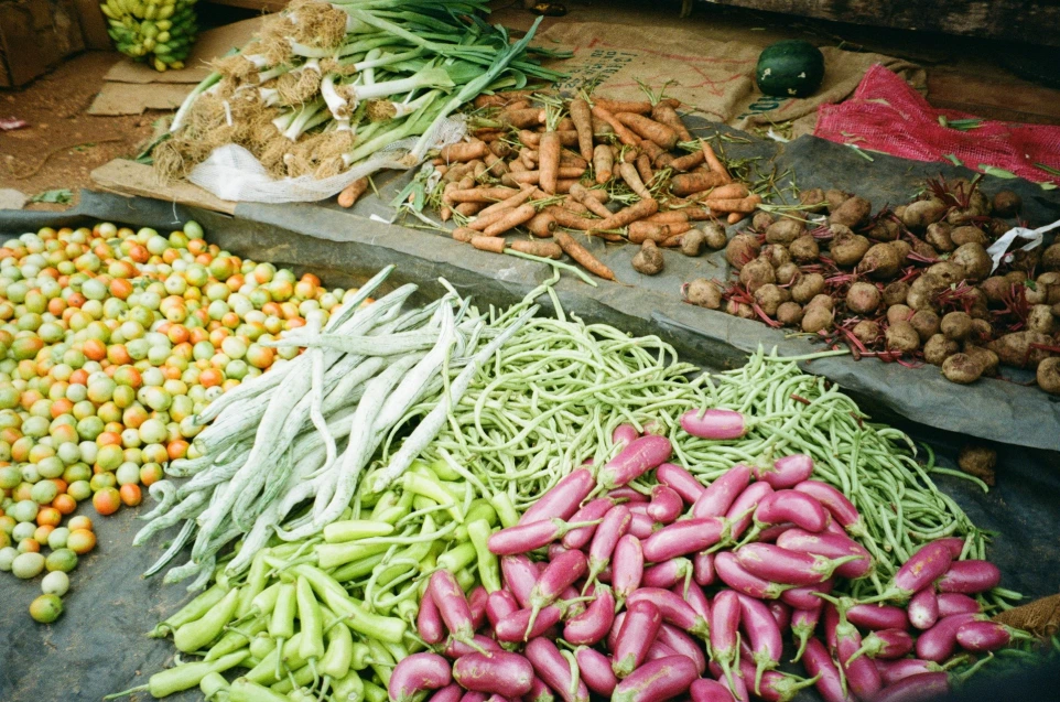 A colorful assortment of fresh vegetables at a market stall.